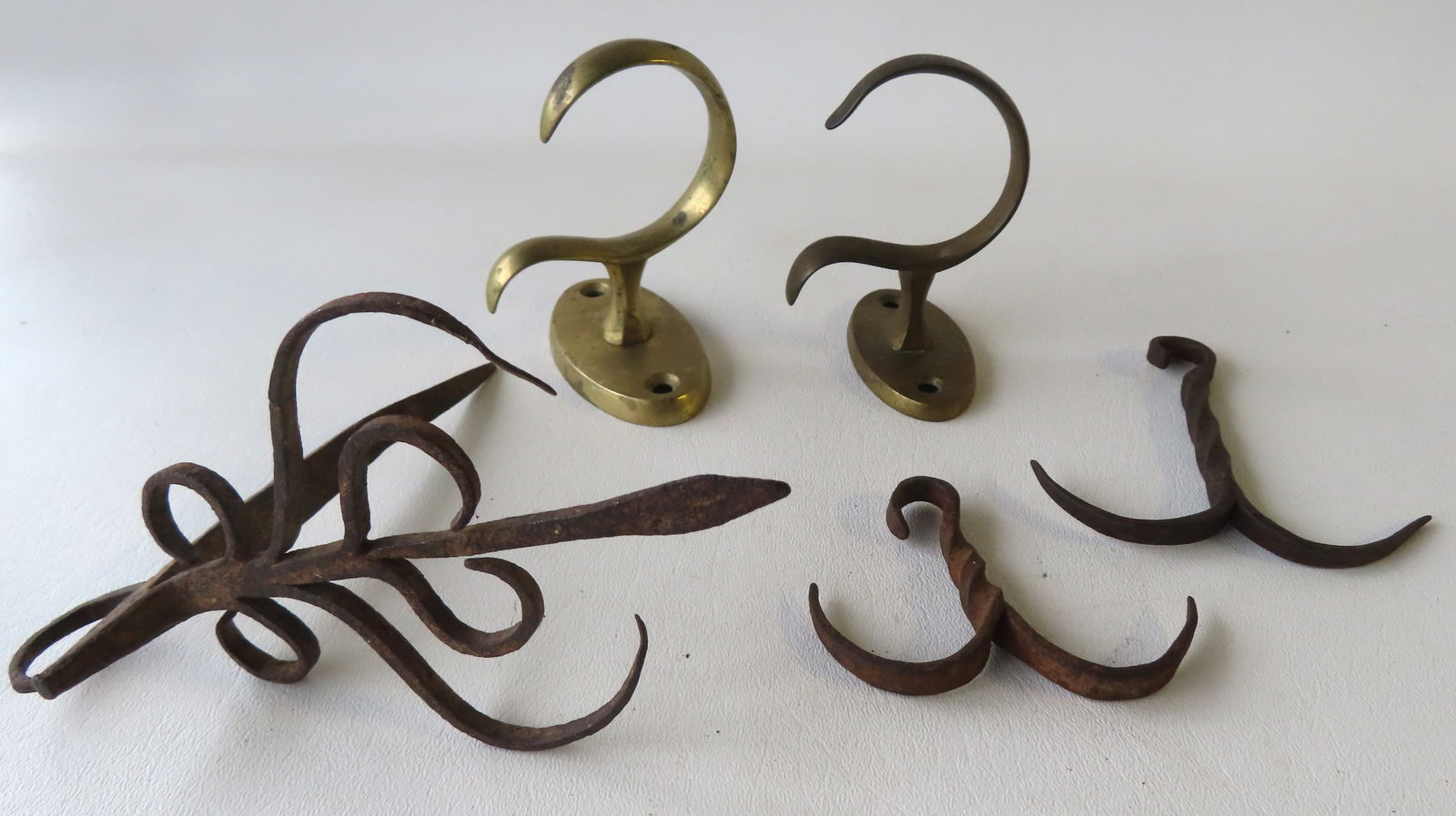 Grouping of 5 early hearth and lighting collectibles including: Matched pair of brass jam hooks, (1 of 9)
