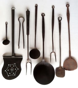 Grouping of 9 early handmade iron and tin kitchen utensils including: Tin spatula with pierced blade