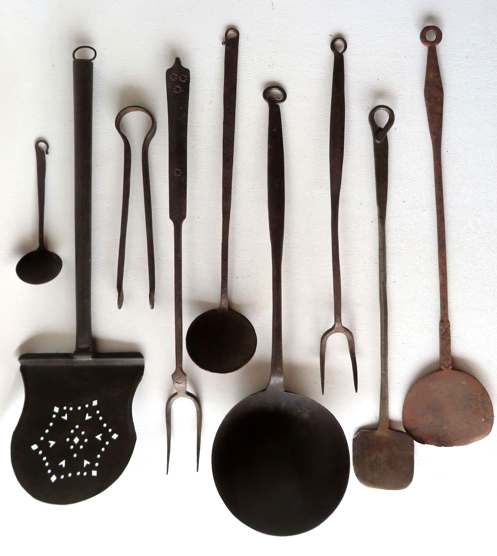 Grouping of 9 early handmade iron and tin kitchen utensils including: Tin spatula with pierced blade (1 of 17)
