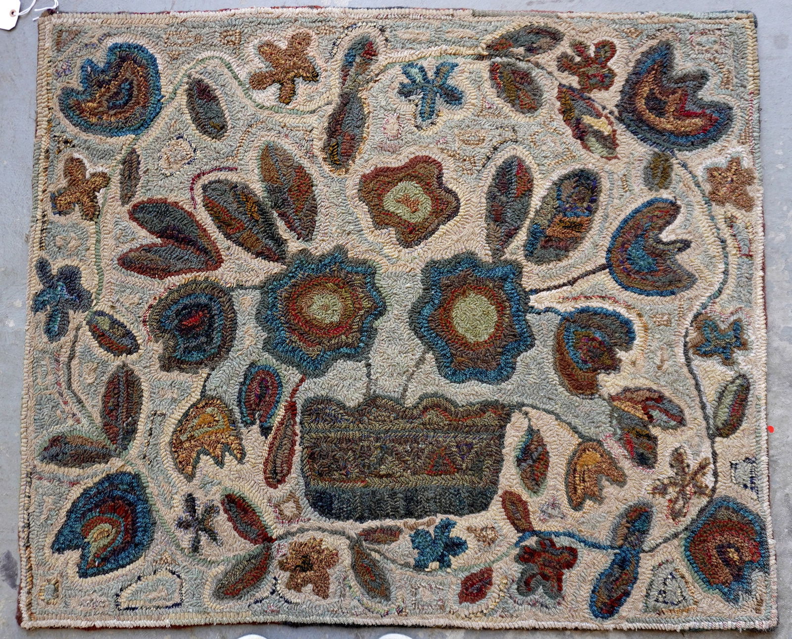 Folk art pictorial hooked rug with a central image of a basket of flowers with a floral and vine (1 of 7)