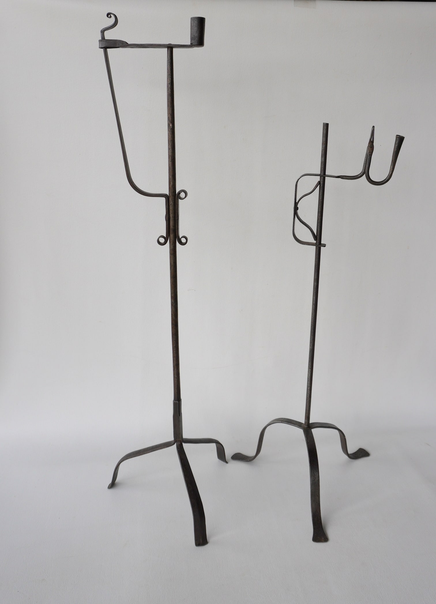 Two hand forged iron floor standing lighting devices, one with spring load taper and candle holder, (1 of 20)