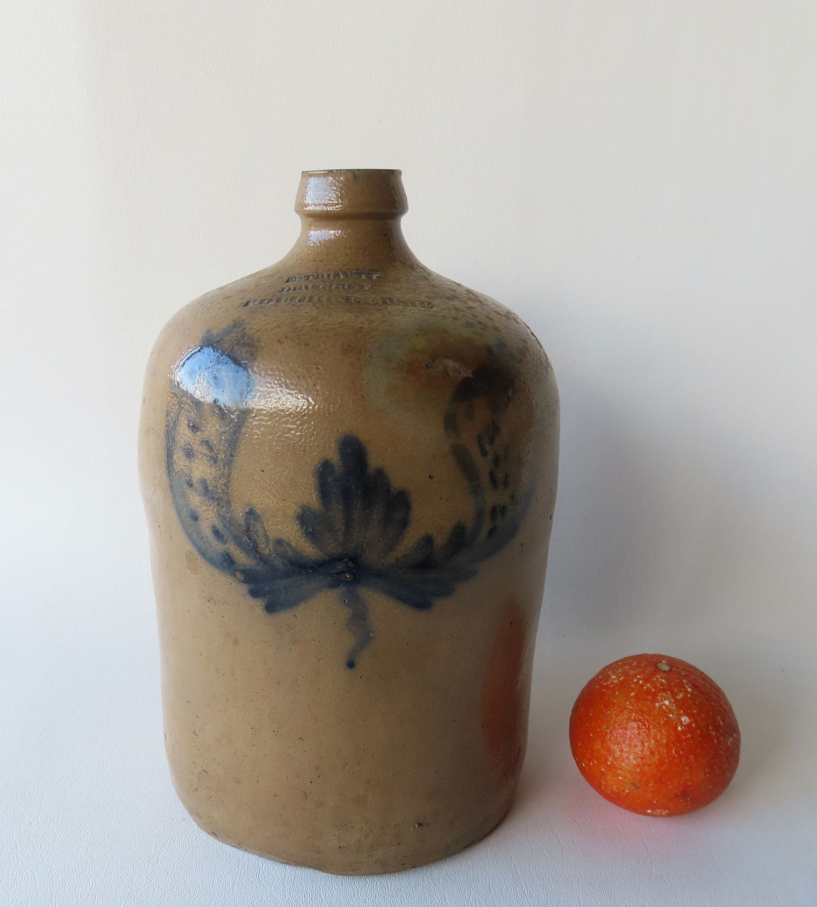 A small stoneware jug, marked "E. Triaett / Druggist / Poughkeepsie", decorated with a cobalt blue (1 of 6)