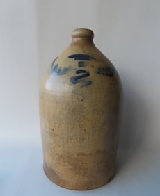 A stoneware 4 gallon jug marked "M.C. Webster & Sons / Hartford CT.", decorated with a cobalt blue