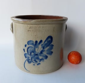 Stoneware crock marked "Adam Caire / Po'Keepsie N.Y." decorated with a large cobalt blue flower and