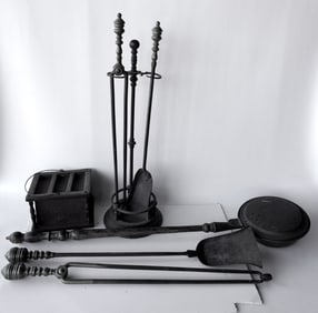 Grouping of hearth items including: Pierced tin foot warmer; a pierced brass bed warmer with a grain