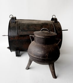 Two early hearth items including: A large tin roasting oven with hand forged iron skewer with