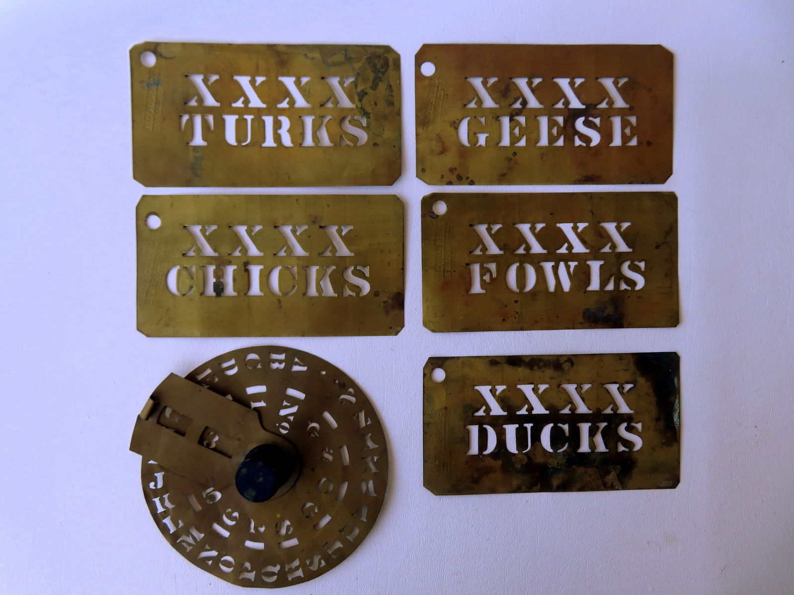 A grouping of farm related brass stencils. including: DUCKS, CHICKS, TURKS, FOWLS, and GEESE- each (1 of 6)