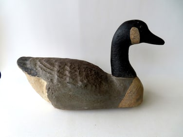 A hand painted goose decoy in balsa wood, glass eyes, possibly Herter's. Very good condition in