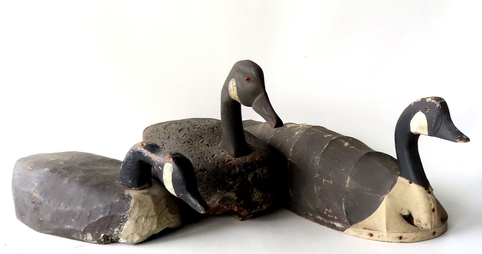 Three primitive goose decoys. 1) Carved wooden goose with hissing head, and body carved from a log - (1 of 17)