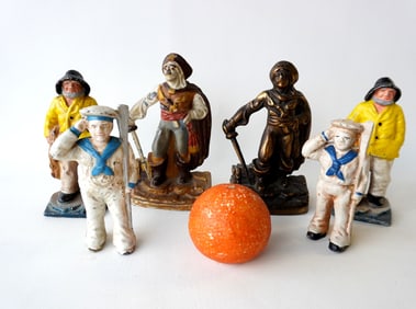 Grouping of 6 figural nautical related collectibles including: Two pirate form door stops, one in