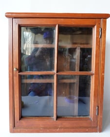 A small country pine wall cupboard having a single door with 4 lights, mortised and tenon