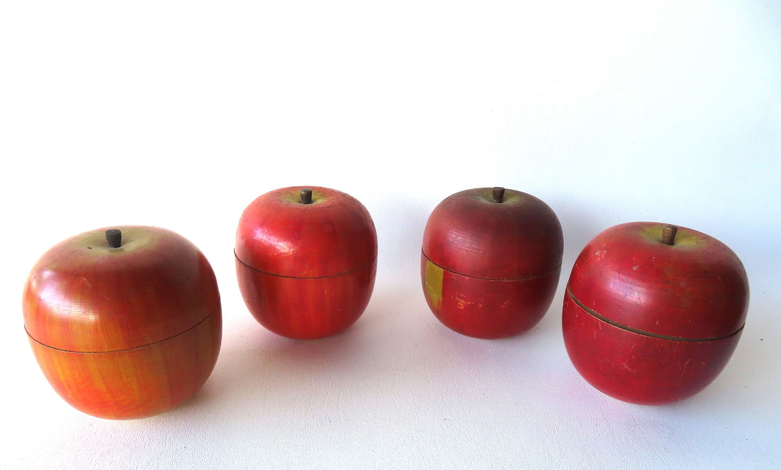 Grouping of 4 hand painted wooden oversized apples with race horse game on interior, early to mid (1 of 11)