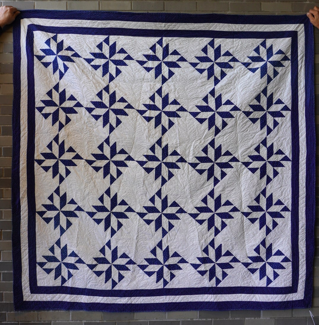A blue and white patchwork quilt in pinwheel pattern with triple linear border, all hand sewn, late (1 of 9)