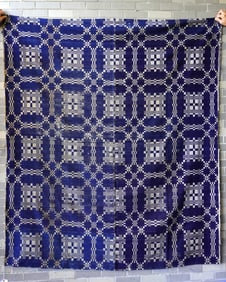A blue and white coverlet with century seam, geometric pattern, some use wear but overall fair to