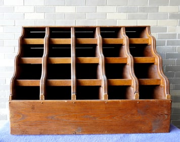 An unusual country store oak counter top display case with 5 over 4 graduated serpentine shaped
