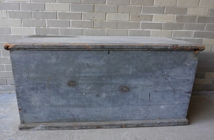 A large primitive blanket box in original blue-gray paint, rattail hinges, original lock and hasp,