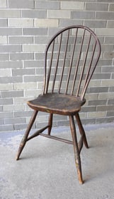 A bow-back Windsor side chair with turned stretchers, splayed legs and saddle feet,