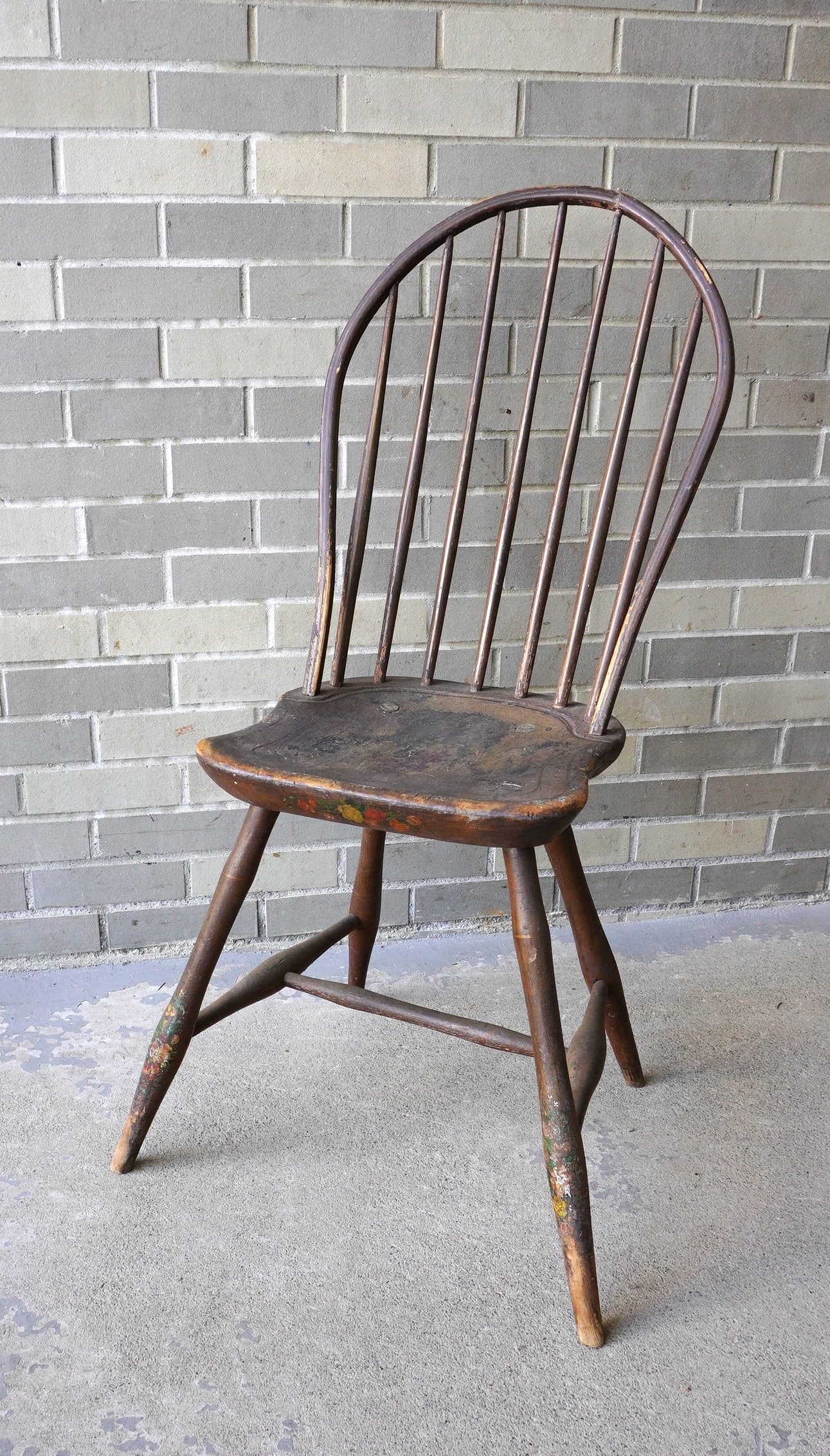 A bow-back Windsor side chair with turned stretchers, splayed legs and saddle feet, (1 of 12)