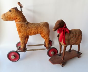 Two small horse toys, both with losses. The earliest mounted on wooden platform is missing 1 wheel