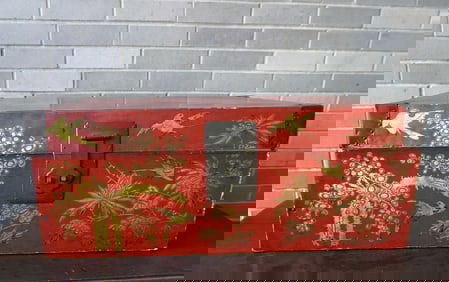 An oriental lacquered red trunk with gilded flowers and birds, very good condition. Original