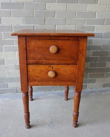 A Sheraton cherry 2 drawer stand with turned legs. Expansion crack in top, else good condition,
