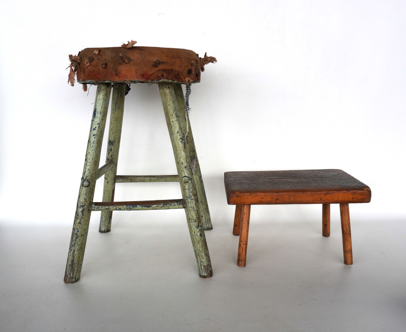 An early primitive hand made stool, with rough cut wooden seat, layers of old paint - earliest color (1 of 16)
