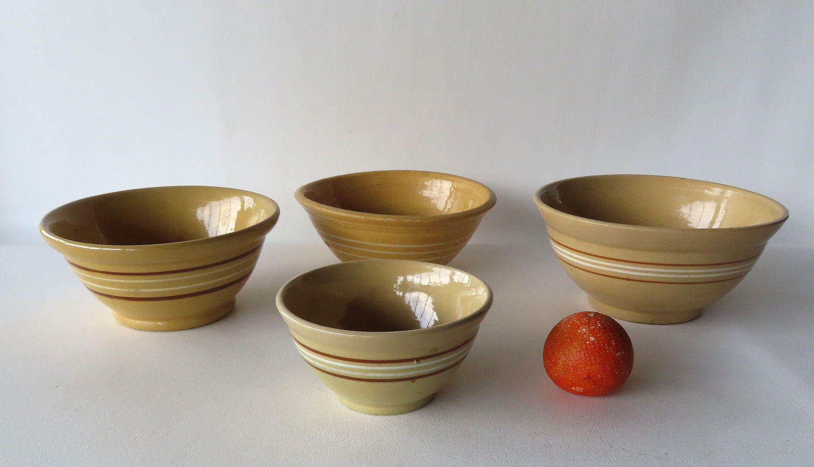Grouping of 4 yellowware mixing bowls, all with some use wear, but overall very good condition with (1 of 13)