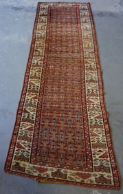 Oriental runner, hand knotted, low pile, mid to late 19th century. Some losses along the edges, else