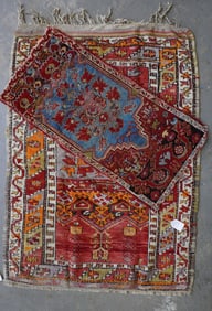 Two oriental scatter rugs, late 19th to early 20th century. The largest with some use wear, and