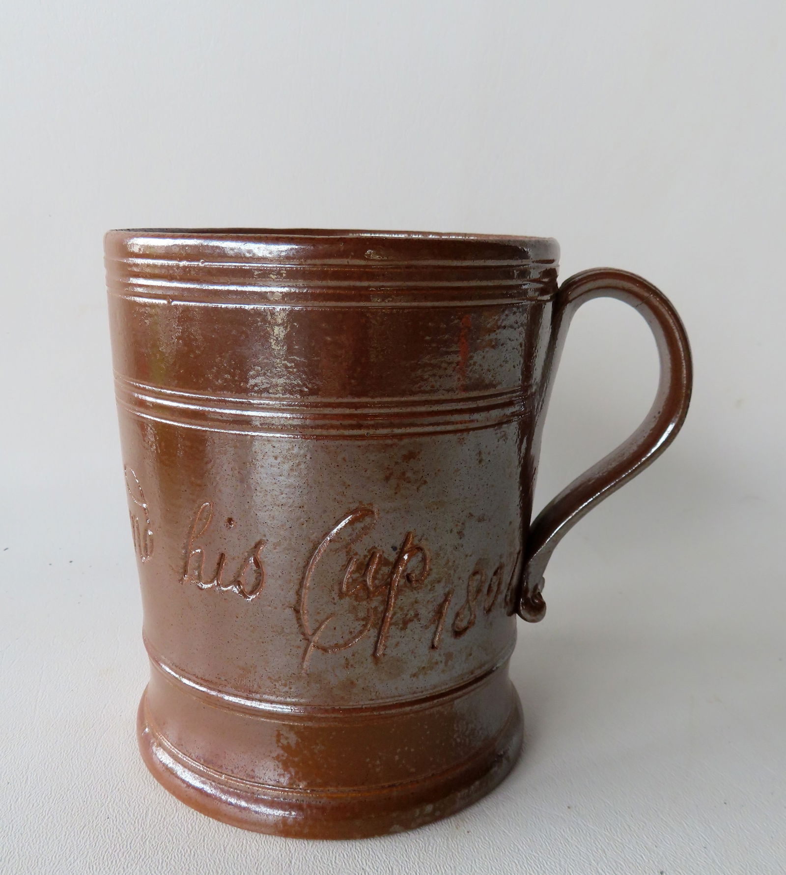 English brown salt glazed tankard marked "Thomas Wormand His Cup 1807". (1 of 12)