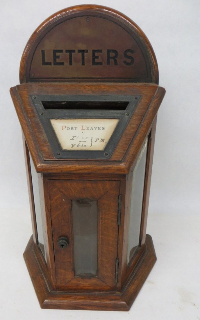 Oak letter box with beveled glass door and side pan: Oak letter box with beveled glass door and side panels - upper brass plaque labeled "Letters" - original lock (no key) - one broken hinge on door otherwise excellent overall condition - late 19th cent