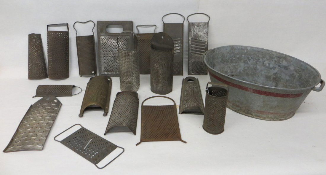 lot of 18 various tin graters ranging in size from: lot of 18 various tin graters ranging in size from 8"H to 13"H together with a small tin washtub. All mid-19th to early 20th century.