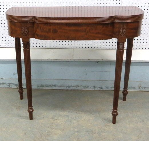 Sheraton mahogany game table with reeded legs, ree: Sheraton mahogany game table with reeded legs, reeding around clover-leaf shaped top. 36"L x 18"W x 29.5"H.