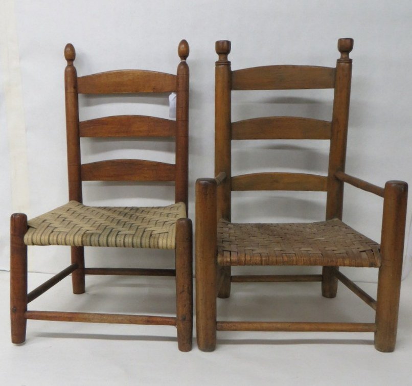 Pair of child's ladder back chairs.: Pair of child's ladder back chairs.