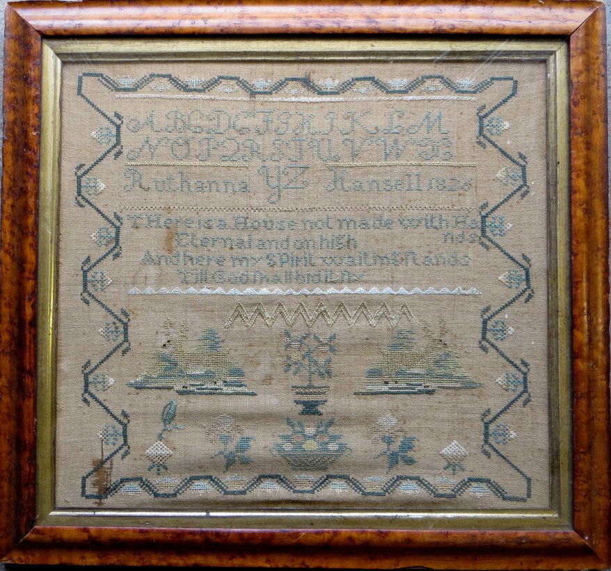 Alphabet and motto sampler signed Ruthanna Hansell: Alphabet and motto sampler signed Ruthanna Hansell 1826. Decorated with deer, basket of flowers, urn with flowers, with vine and floral border. 17" x 16".