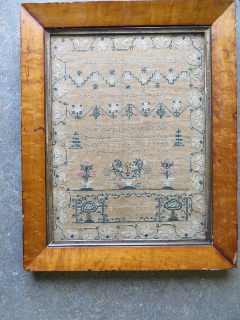Alphabet and motto sampler signed Ann Martha Beaco: Alphabet and motto sampler signed Ann Martha Beacon 1812 - Decorated with trees and potted flowers surrounded by vine and floral border - original birdseye maple frame - 11" x 15".