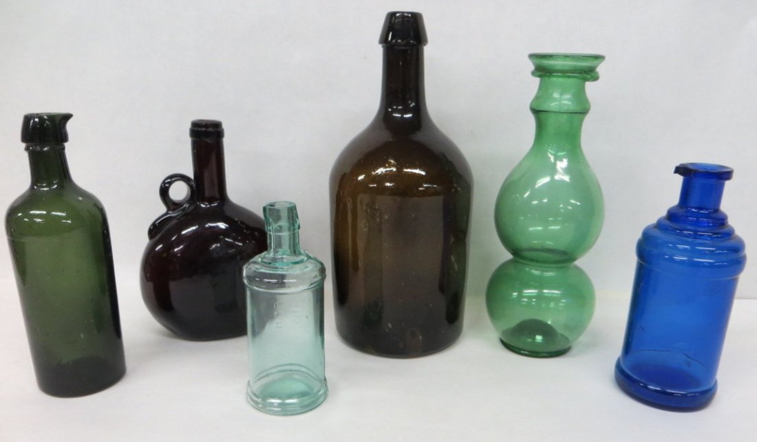 Six early bottles including amber bottle with appl: Six early bottles including amber bottle with applied top - 11.5"H, red bottle with applied handle - 8"H, green bulbous hand blown bottle with applied top - 10"H, cobalt blue medicinal bottle with ste