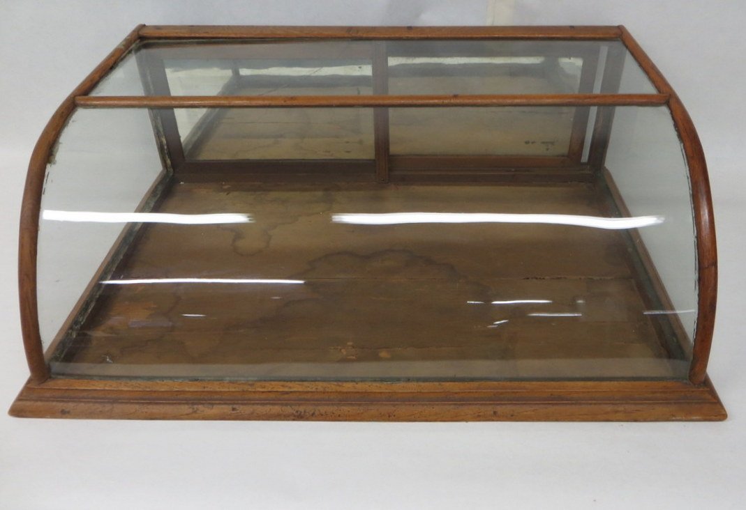 Table top oak showcase with curved front, mirrors : Table top oak showcase with curved front, mirrors on back sliding doors. 19th century. 35"L x 23"W x 11.75"H.