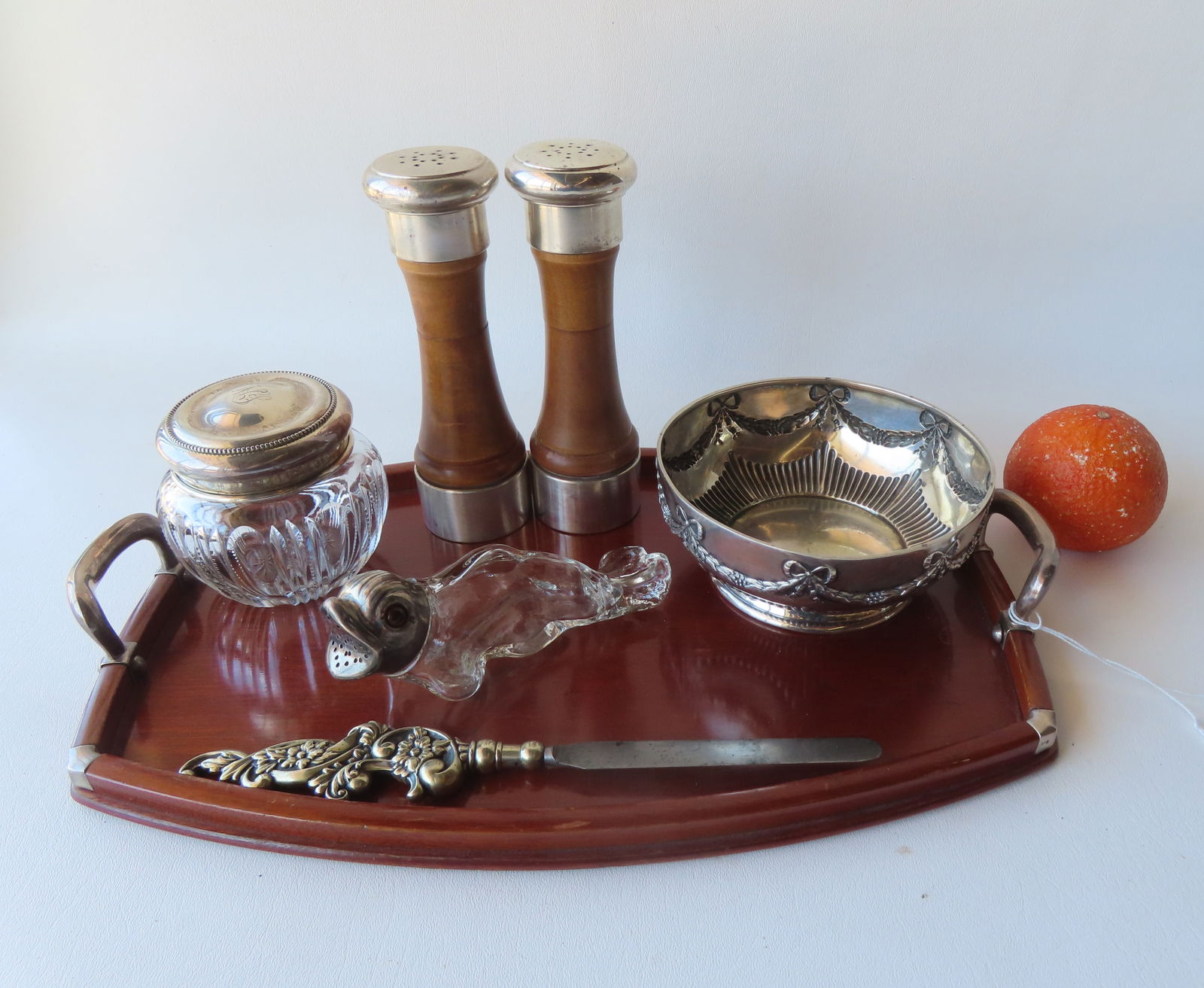 Grouping of decorative objects including sterling silver collectibles: Tall pair of sterling salt &: Grouping of decorative objects including sterling silver collectibles: Tall pair of sterling salt & pepper shakers with wooden columns; a fancy silver plate bowl decorated with ribbons and wreaths aro