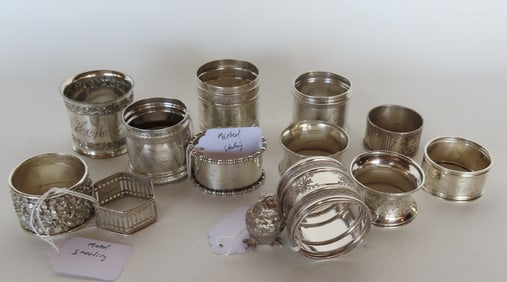 Grouping of 13 non-matching silver napkin rings, most Victorian era, 5 marked sterling weighing 4.2