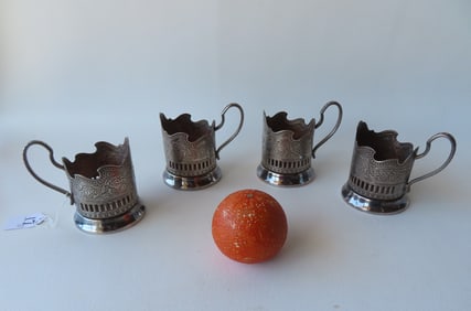 Grouping of 4 Soviet Union silver plated cup holders with rockets and Sputnik motif - 3 3/8"