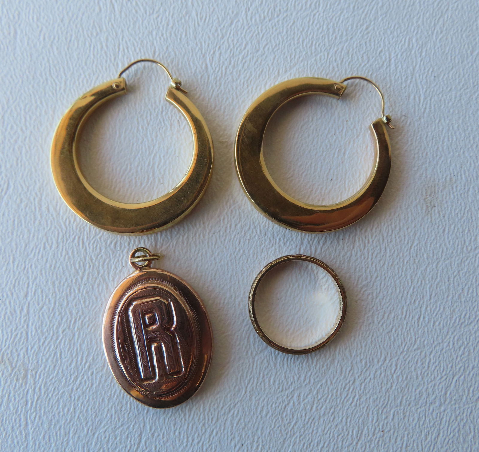 Four pieces of 14k gold jewelry including earrings, pendant and ring. Total weight 8 grams. All gold (1 of 3)