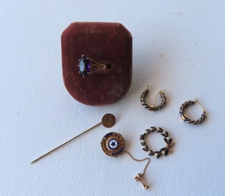 Four pieces of gold and silver jewelry including: An 1856 California Indian head coin, 25 cents,