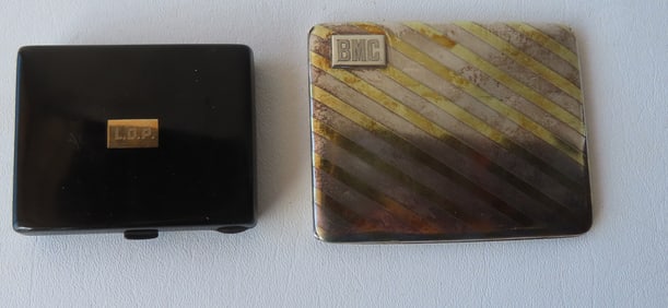 Two Sterling silver cigarette cases. The first with enameled covers and interior marked "Sterling /