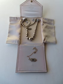 Two pieces of sterling jewelry including a beaded necklace in original case signed Cromwell & Co.