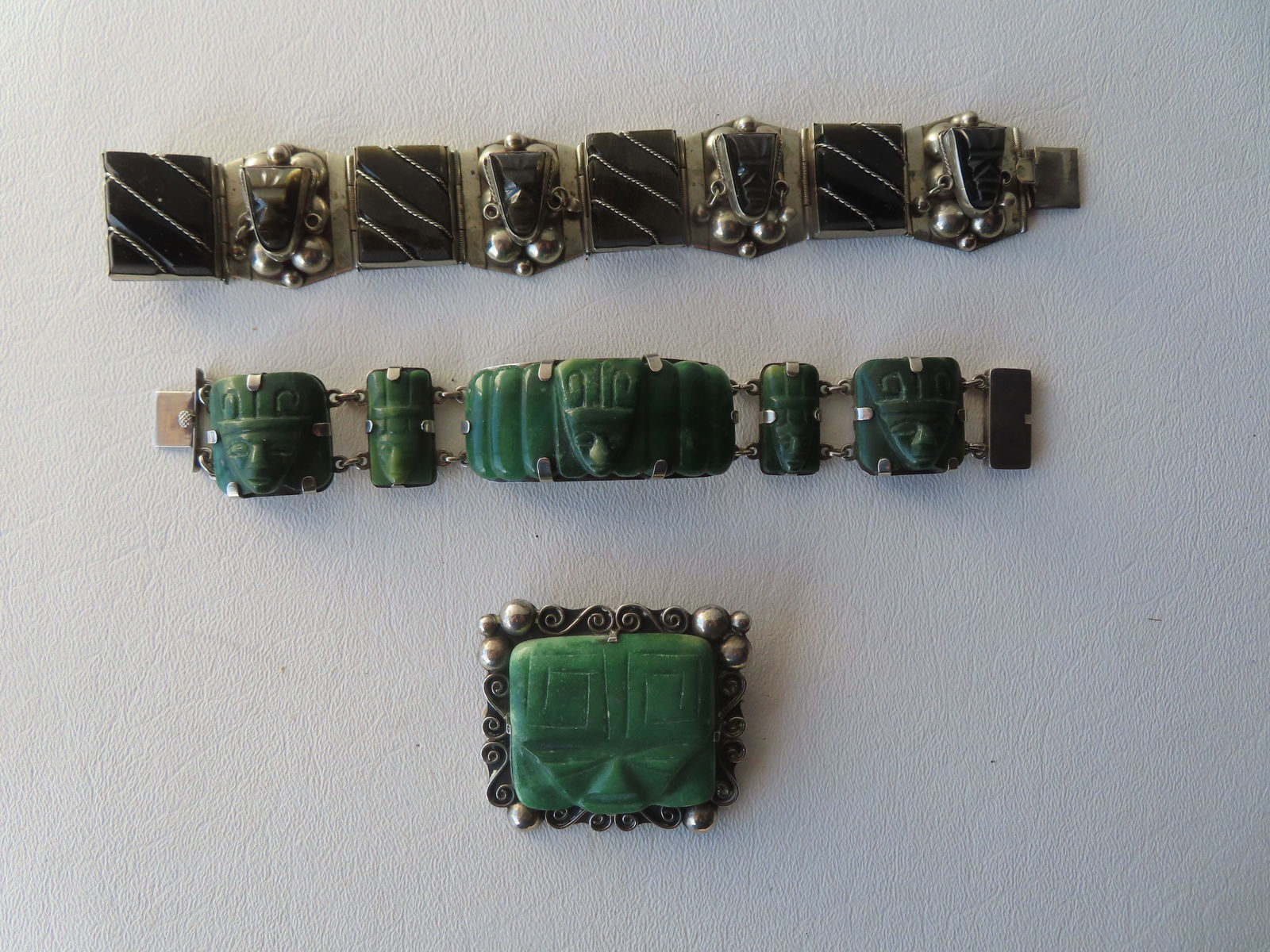 Three pieces of Aztec style Mexican silver jewelry including: Sterling bracelet decorated with onyx (1 of 5)