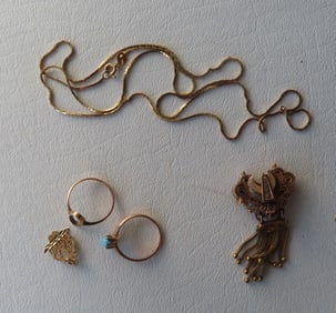 Small grouping of gold lady's jewelry including: Ring, missing stone - tested to 10k; ring with