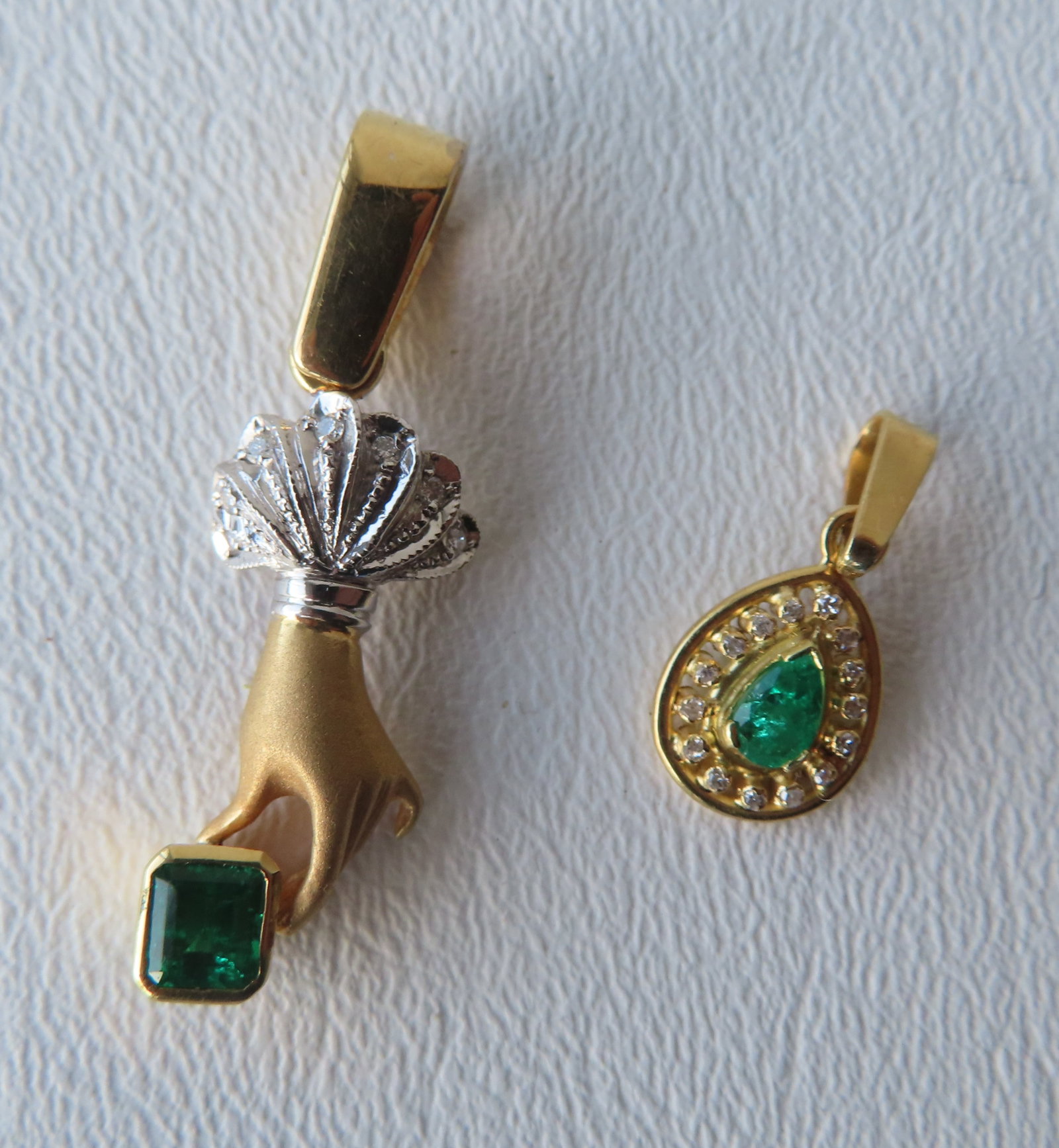 Two pieces of 18K gold jewelry. The first a Victorian pendant in the form of a lady's hand holding a: Two pieces of 18K gold jewelry. The first a Victorian pendant in the form of a lady's hand holding a green multi-faceted stone - unmarked but tested to 18K - the stone has not been tested - weighs 6 g