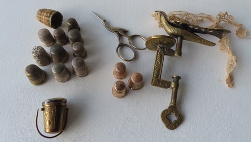 Three 14k gold thimbles -9 grams , plus other sewing notions including a sewing bird patent 1858 -