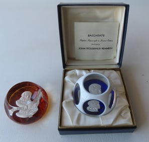 Two glass paperweights of historical figures: The first, a sulphide cameo of John F. Kennedy in